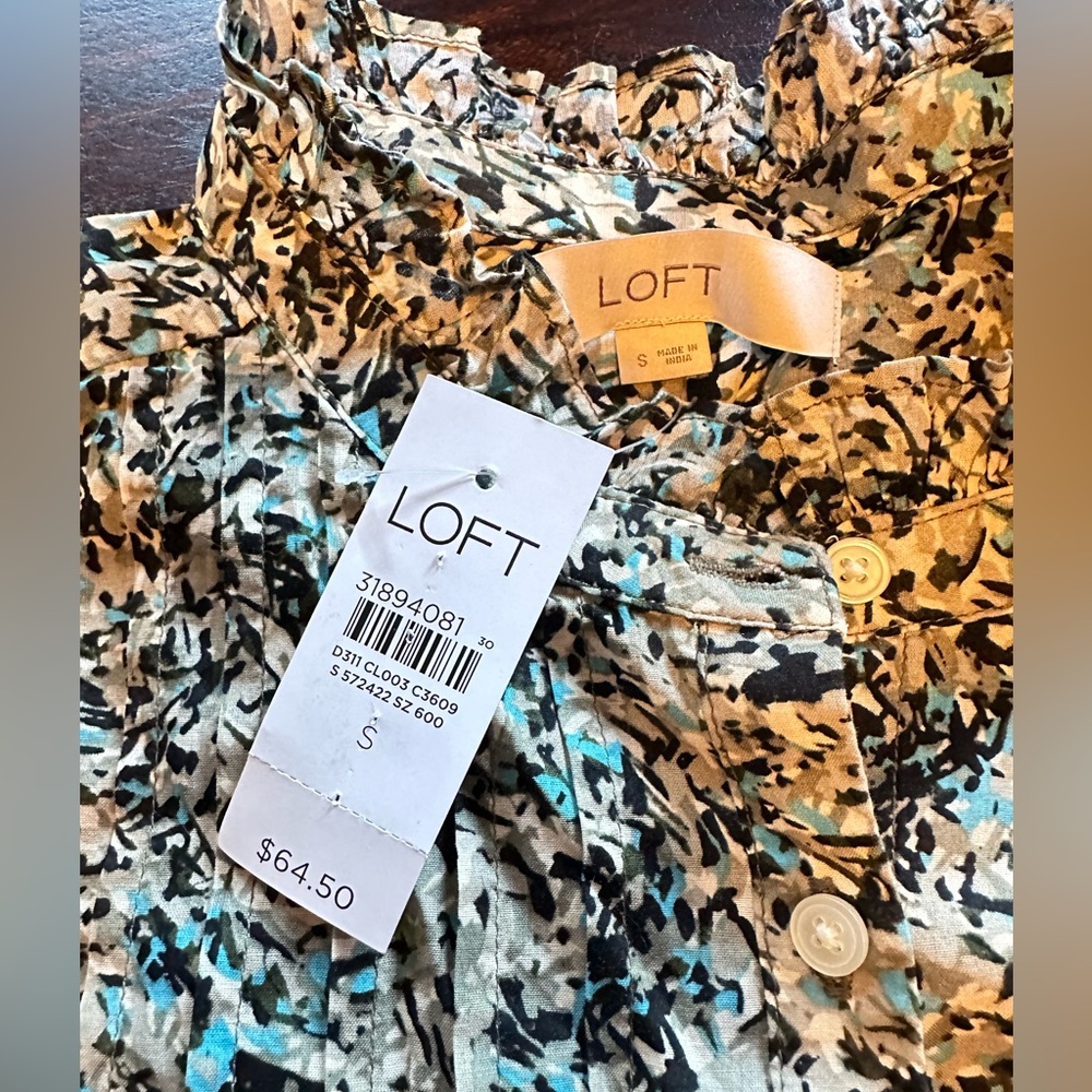 Loft  brand ruffled light floral shirt.